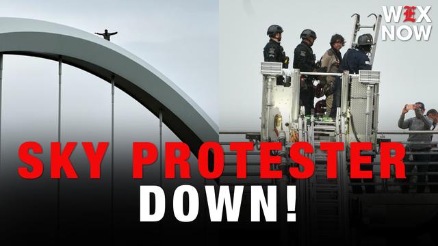 Frederick Douglass bridge protester climbs down after five days in the sky