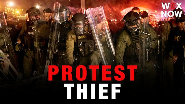 New Jersey charges officer in theft of AP journalist’s camera bag